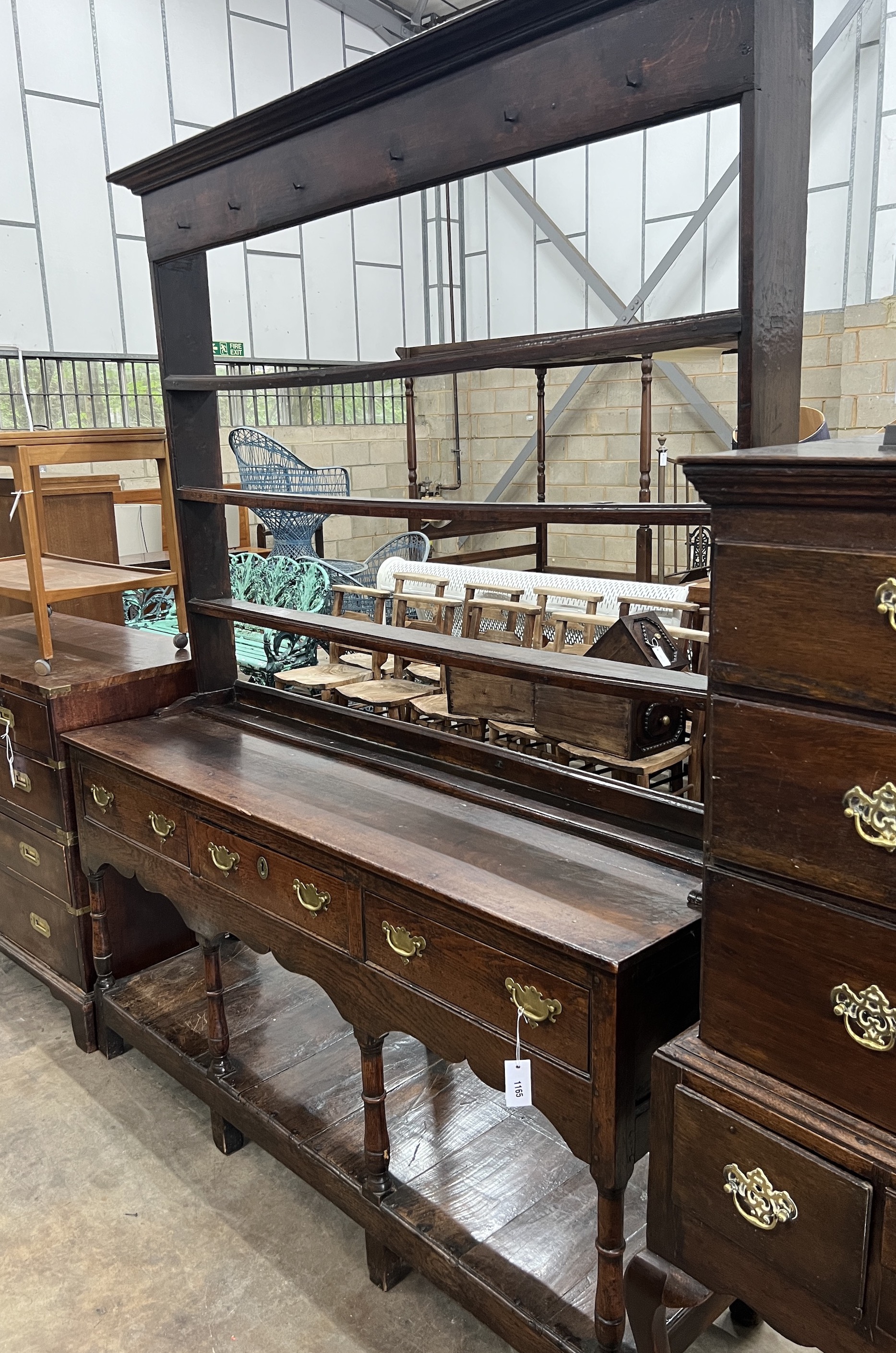 An 18th century oak potboard dresser with open rack, width 159cm, depth 45cm, height 206cm